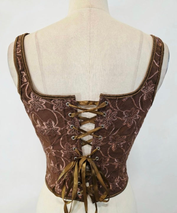 Sleeveless embroidered top with lace up front and back detail