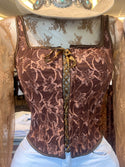 Sleeveless embroidered top with lace up front and back detail