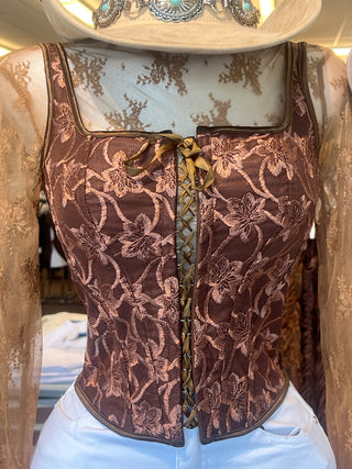 Sleeveless embroidered top with lace up front and back detail